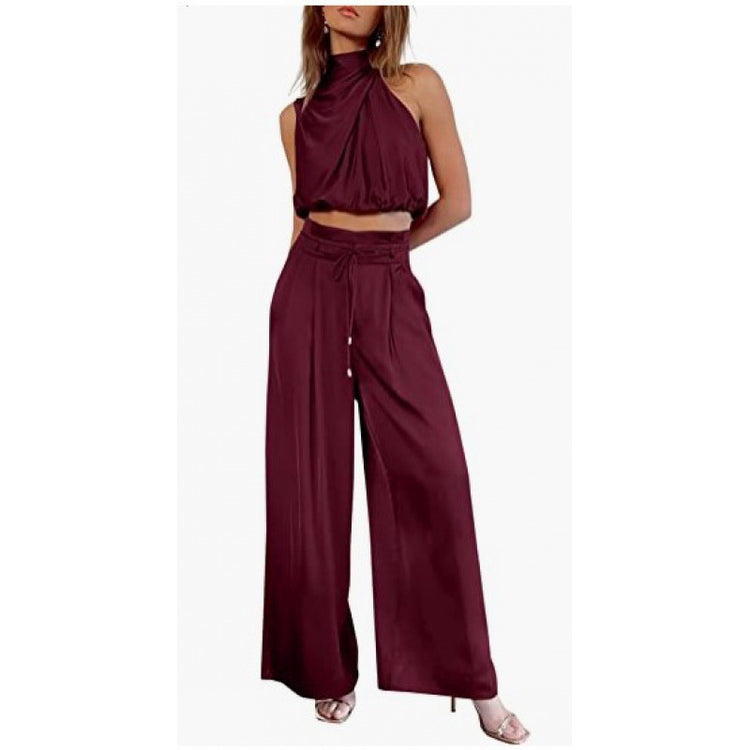 Burgundy two-piece outfit with a halter top and wide-leg pants on a white background