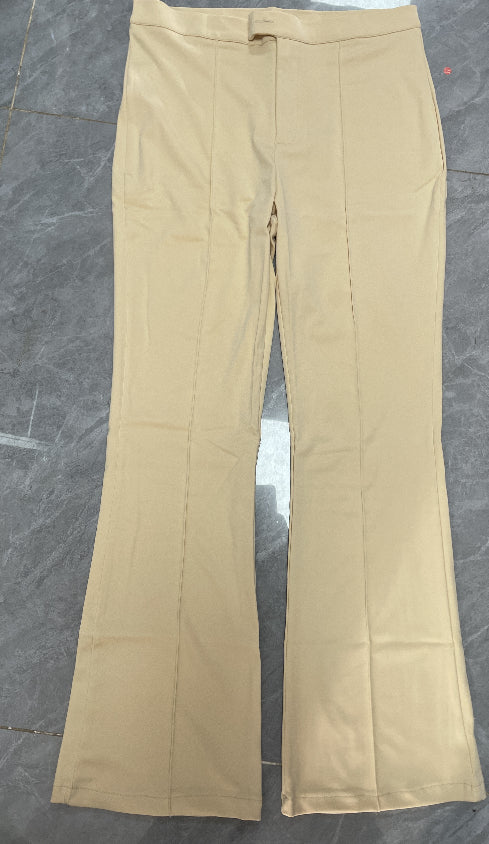 Beige pants on a dark marble surface