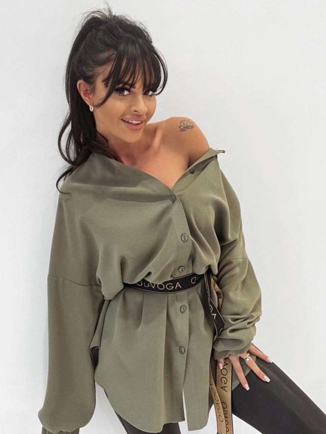 Woman wearing an olive green off-shoulder top with &