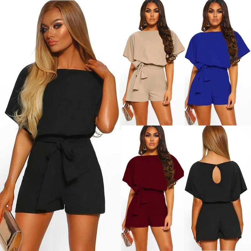 Woman modeling a black romper with different color options displayed.