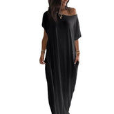 Black off-shoulder dress worn by a model on a white background