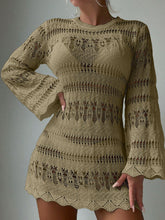 Woman wearing a beige crochet dress against a gray background