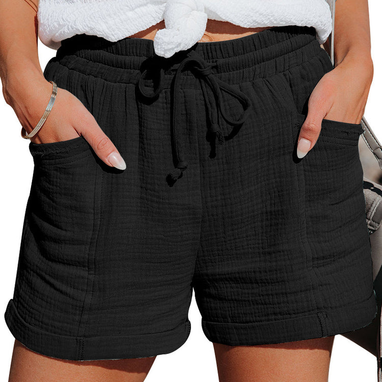 Black shorts with drawstring waist on a white background