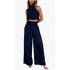 Navy blue jumpsuit worn by a model on a white background
