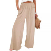 Beige wide-leg pants worn by a person on a white background
