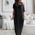 Woman wearing a black off-shoulder dress in a living room setting