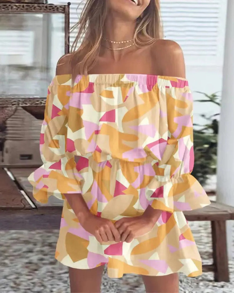 Woman wearing a colorful off-shoulder dress outdoors.