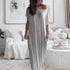 Woman wearing a gray off-shoulder dress in a stylish living room.
