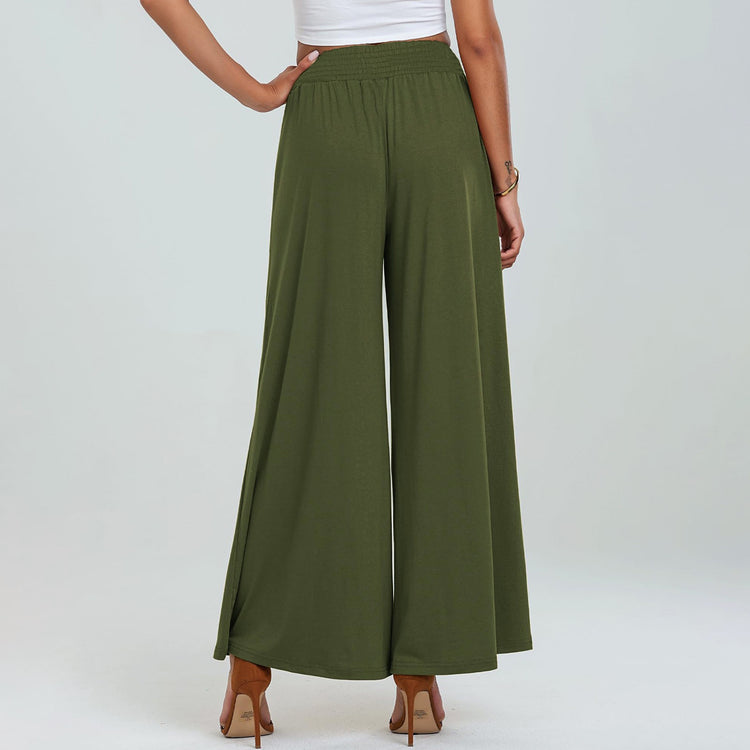 Person wearing olive green wide-leg pants on a white background