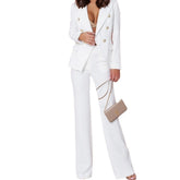 White suit with gold buttons worn by a person on a white background