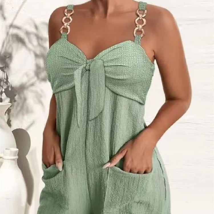 Green dress with a bow detail on a blurred background