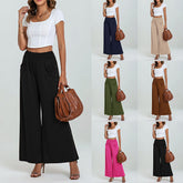 Woman wearing a white top and wide-leg pants with a brown handbag on a white background, shown in multiple color combinations.
