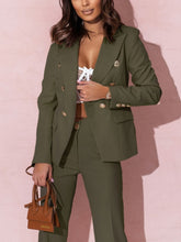 Woman wearing a green suit with a pink background