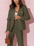 Woman wearing a green suit with a pink background