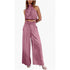 Pink jumpsuit worn by a model on a white background