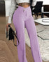 Person wearing lavender pants in an indoor setting