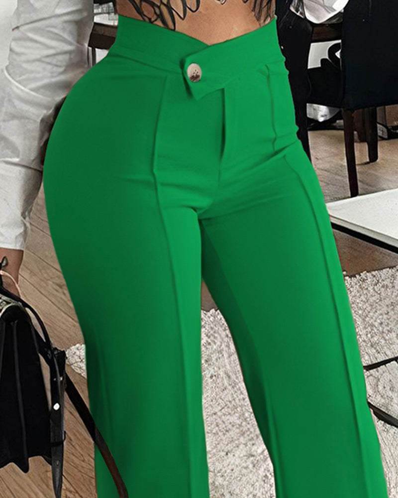 Green pants worn by a person indoors.